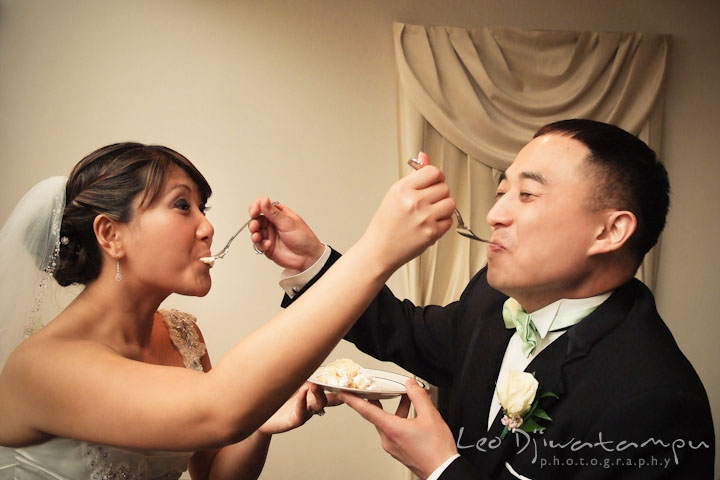 Bride and groom eating the wedding cakeMaid of honor's speech to bride, groom and the rest of the guests. Ceresville Mansion Frederick Maryland Wedding Photo by wedding photographer Leo Dj Photography